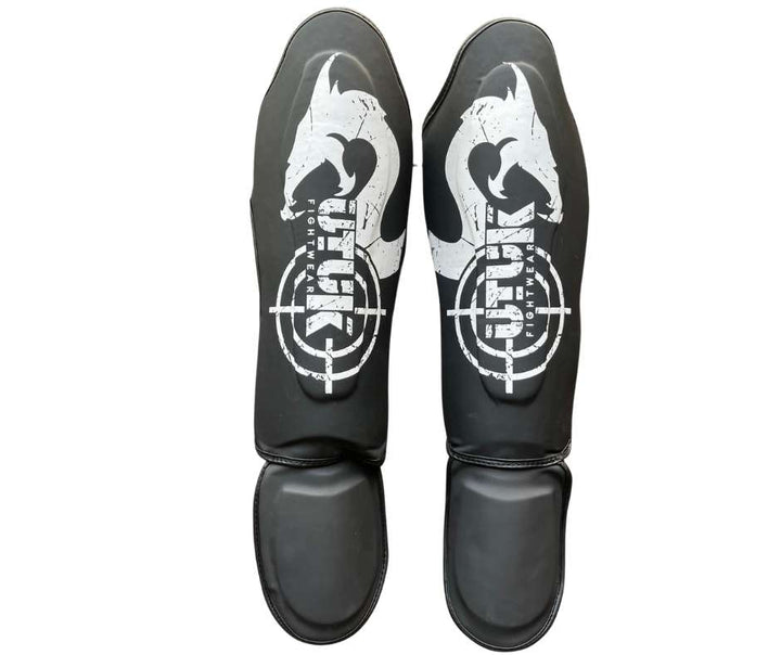 Espinilleras muay thai Utuk hunter negra blanca
