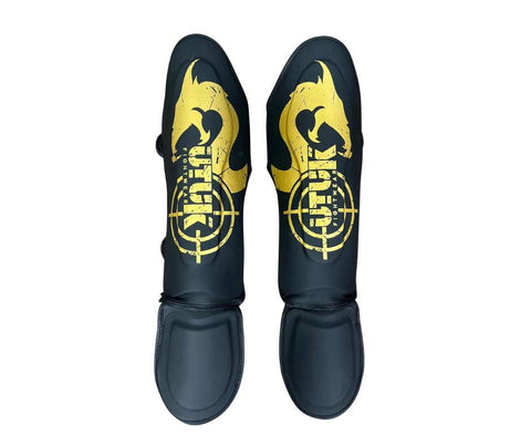 Espinilleras muay thai Utuk hunter negro oro