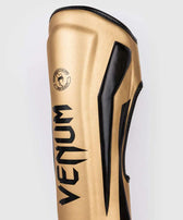 Espinilleras muay thai Venum elite standup oro negro