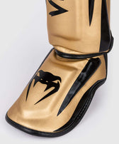 Espinilleras muay thai Venum elite standup oro negro