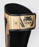 Espinilleras muay thai Venum elite standup oro negro